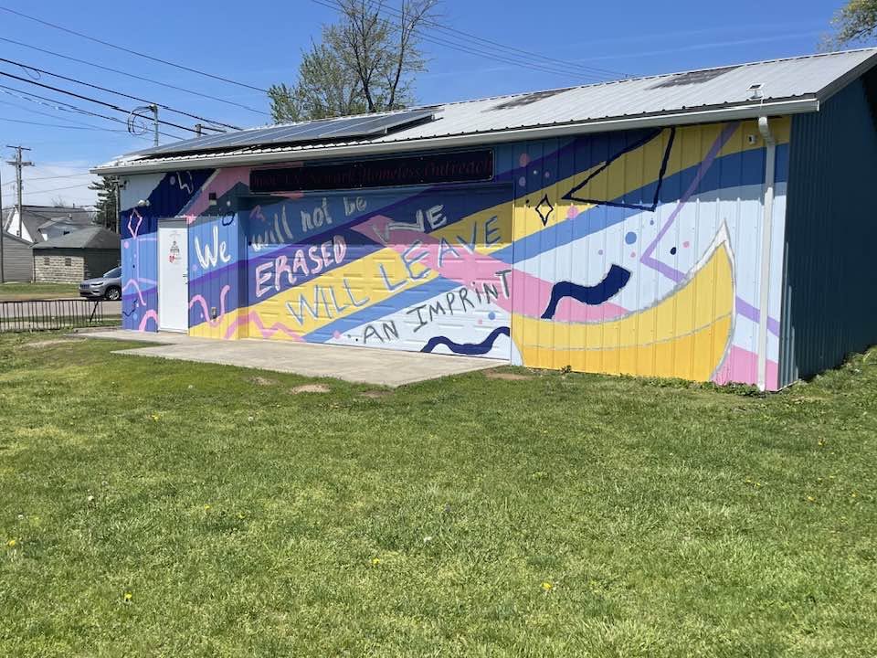 Newark Homeless Outreach building with mural reading 'We will not be erased — we will leave an imprint'